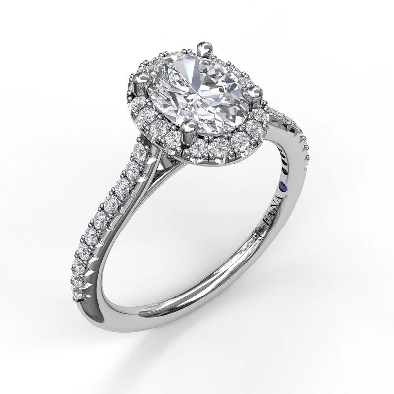 Delicate Oval Shaped Halo And Pave Band Engagement Ring