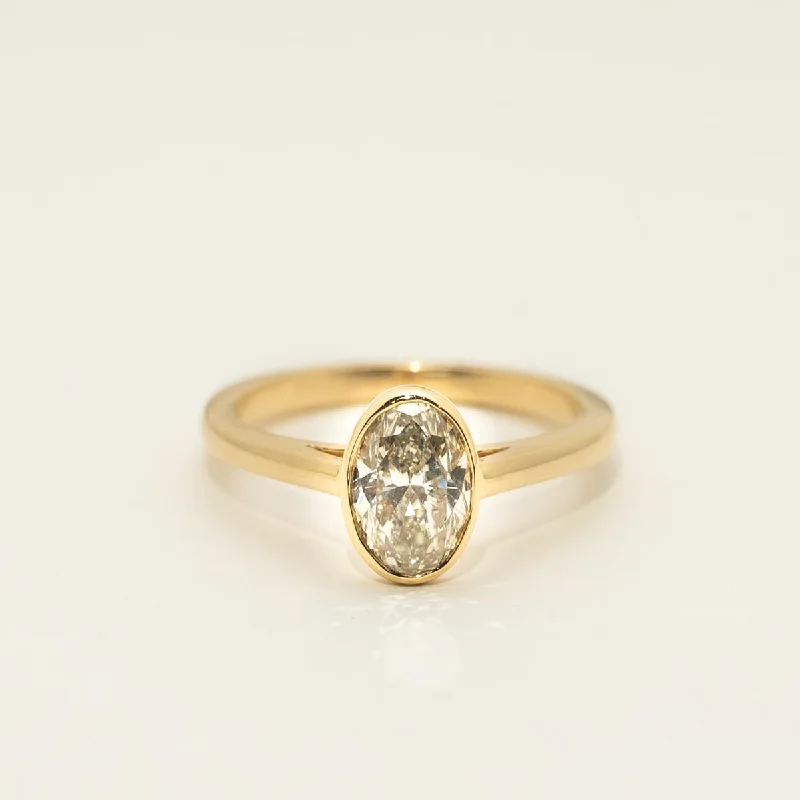 Oval Diamond Bezel Engagement Ring in 18kt Yellow Gold (1 1/4ct)