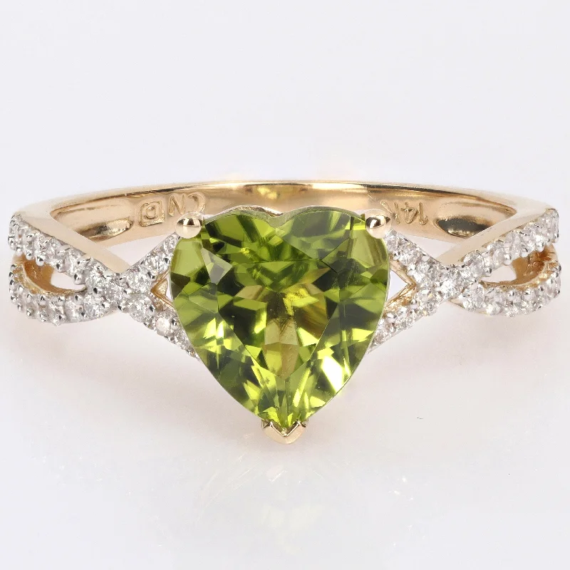 Miadora Heart-cut Peridot and 1/5ct TDW Diamond Crossover Ring in 14k Yellow Gold